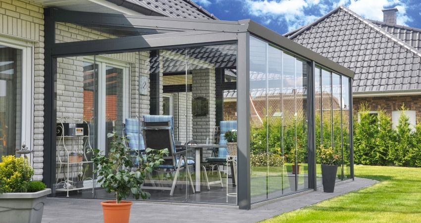 Tuinkamer met glazen schuifwand kopen